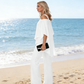 👗✨ Dámská souprava s asymetrickým topem se sifonovým lemem a kalhotami s rozšiřujícími se nohavicemi – 5 barev | M–3XL | Elegantní | Ležérní šik