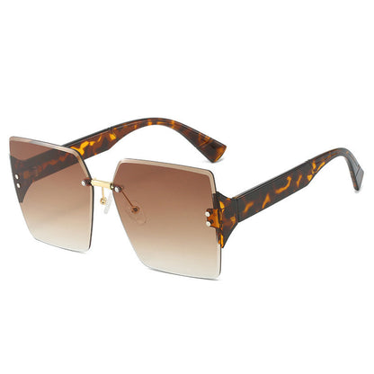 Damen-Sonnenbrille mit großen, randlosen Quadratgläsern